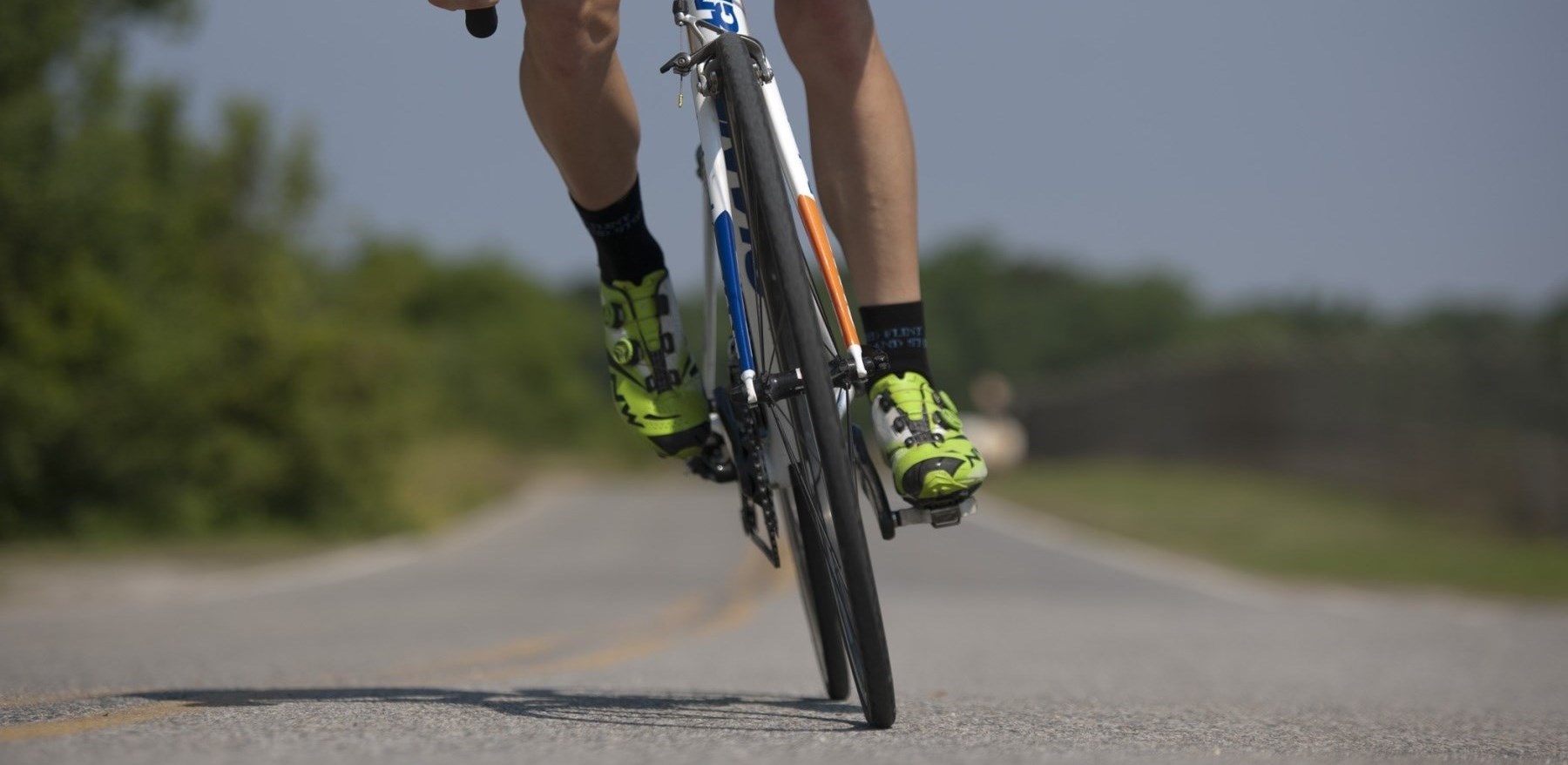 Man biking on country road Man biking on country road